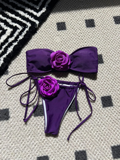 Women's adjustable drawstring tube top swimsuit with high-cut briefs in a solid colour.