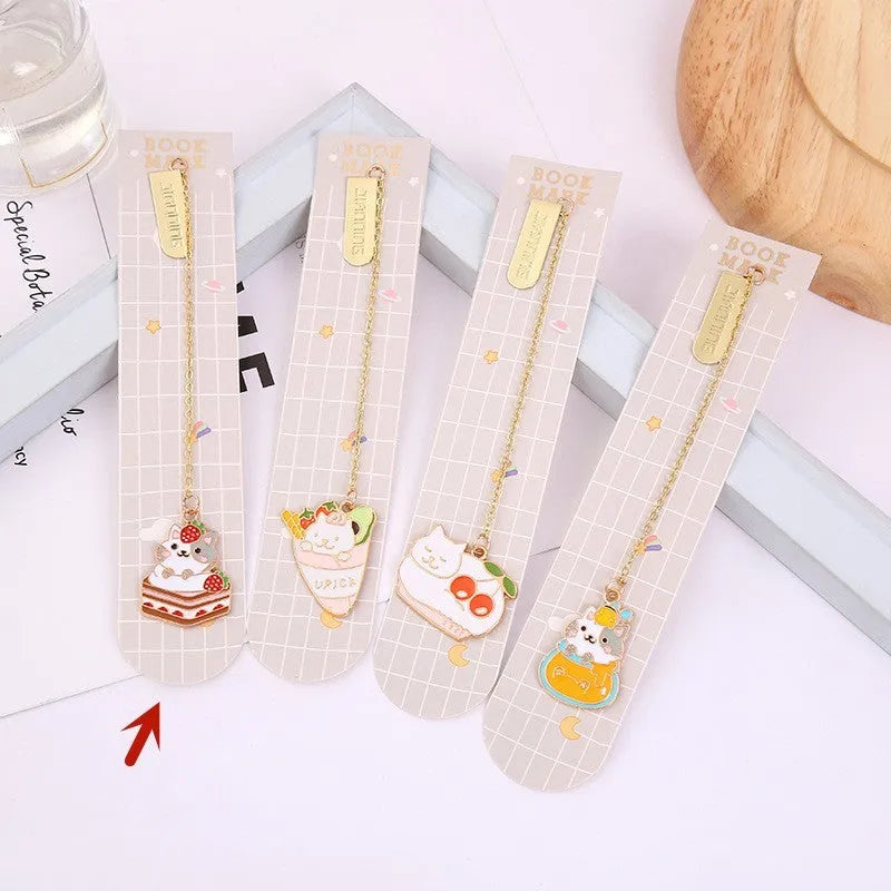 Jane Lime Foodie cat creative metal bookmark with cartoon pendant on a book page.