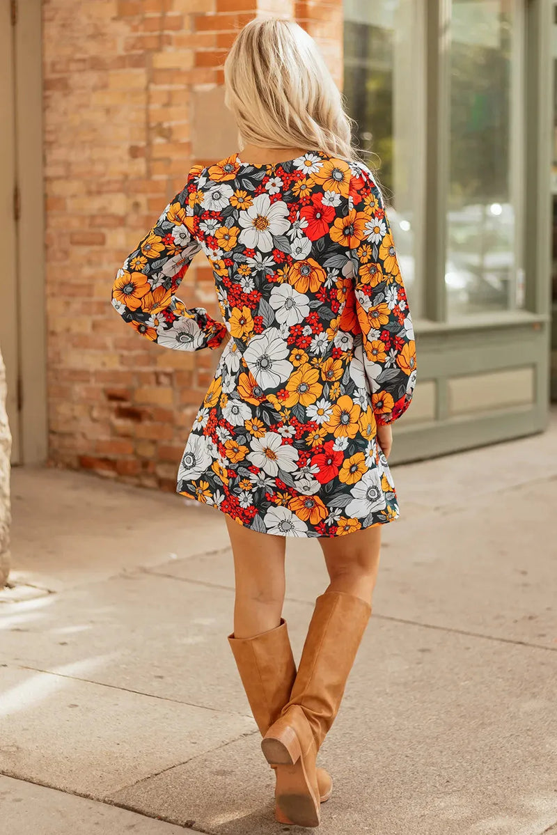 Floral print mini dress with striped lace detailing and V-neck collar, a 100% polyester long sleeve party dress available in orange colour and S, M, L, XL sizes