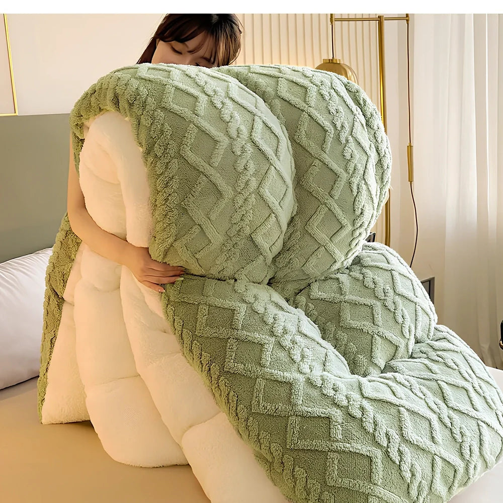 Double quilted plush quilt in sapphire blue showing detailed stitching and German velvet texture