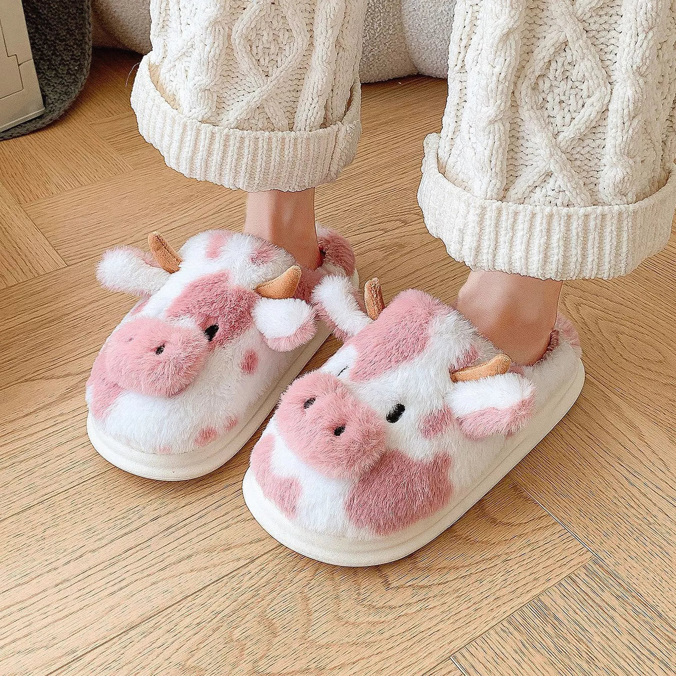 Cartoon cow plush slippers in black, leather red, and brown with non-slip soles