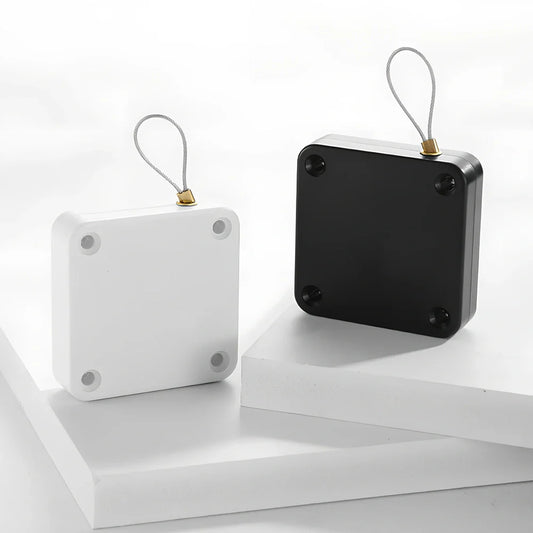 Punch-free automatic retractable sliding door security device with anti-theft cable box measuring 63x63x18mm