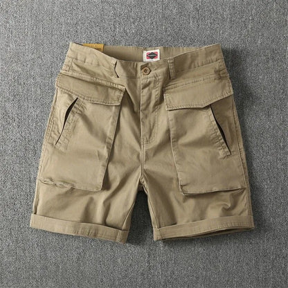 Men's straight-leg cargo shorts in Army Green with multiple pockets, showing micro-elastic cotton fabric detail