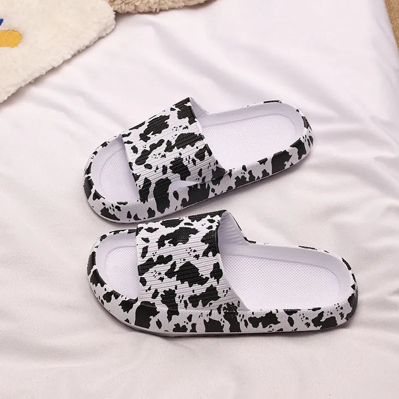 Women's leopard print slippers with a thick EVA sole in multiple colour options on a white background.
