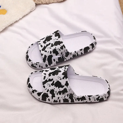 Women's leopard print slippers with a thick EVA sole in multiple colour options on a white background.