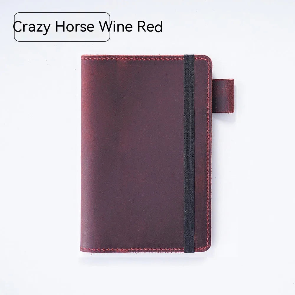 Handmade cowhide kraft notebook open showing wood-free paper, in dark green colour