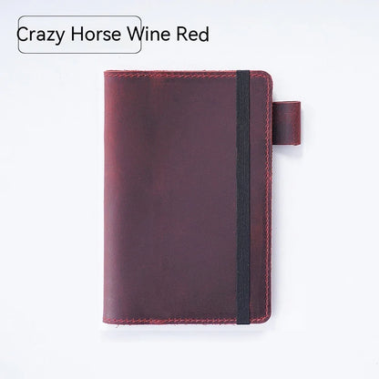 Handmade cowhide kraft notebook open showing wood-free paper, in dark green colour
