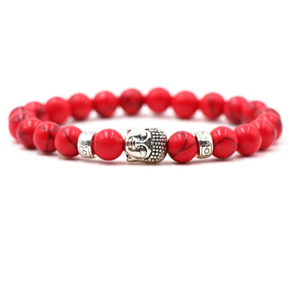 Natural stone stretch bracelet with round beads in various colours including Tigereye and turquoise.