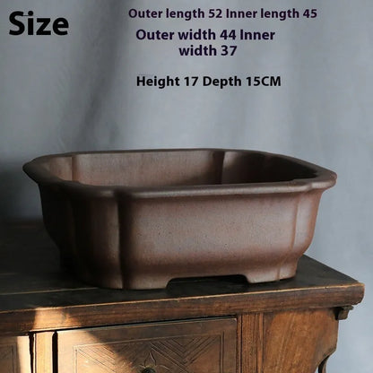 Purple sand rectangular bonsai flower pot measuring 25cm long with natural clay texture