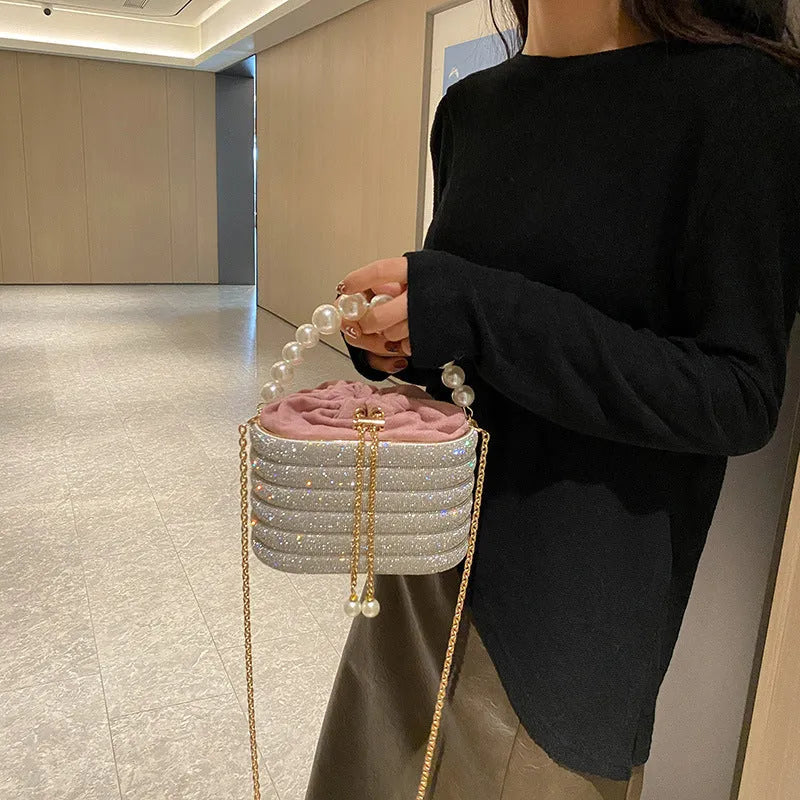 Women's soft PU crossbody bag with beaded accents, round shape, and single shoulder strap in black colour.