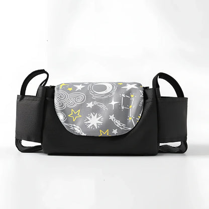 Baby stroller organiser with cup holder mounted on pram pole showing storage compartments