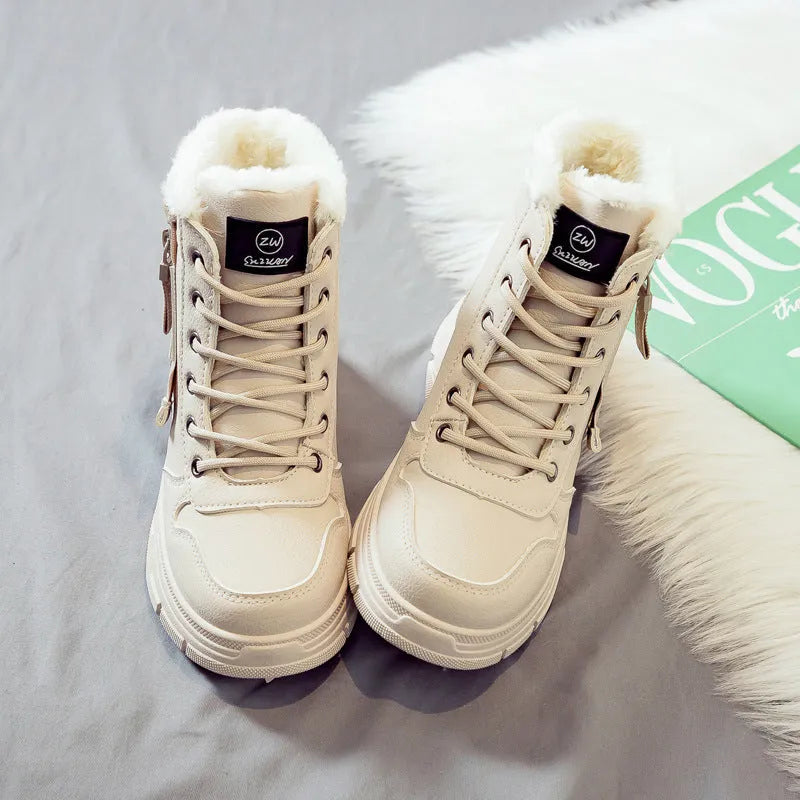 Plus size women's fleece-lined snow boot with tall crown, mid-heel, and front lace-up fastening.