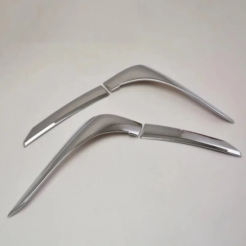 Set of four silver electroplated tail light eyebrow trims for Mitsubishi Outlander on white background.