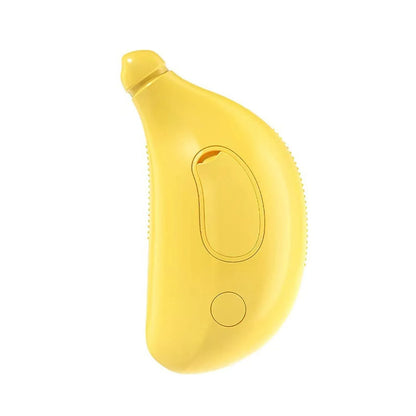 Green Cat Steam Brush with silicone paw-shaped teeth, shown grooming a cat's fur.