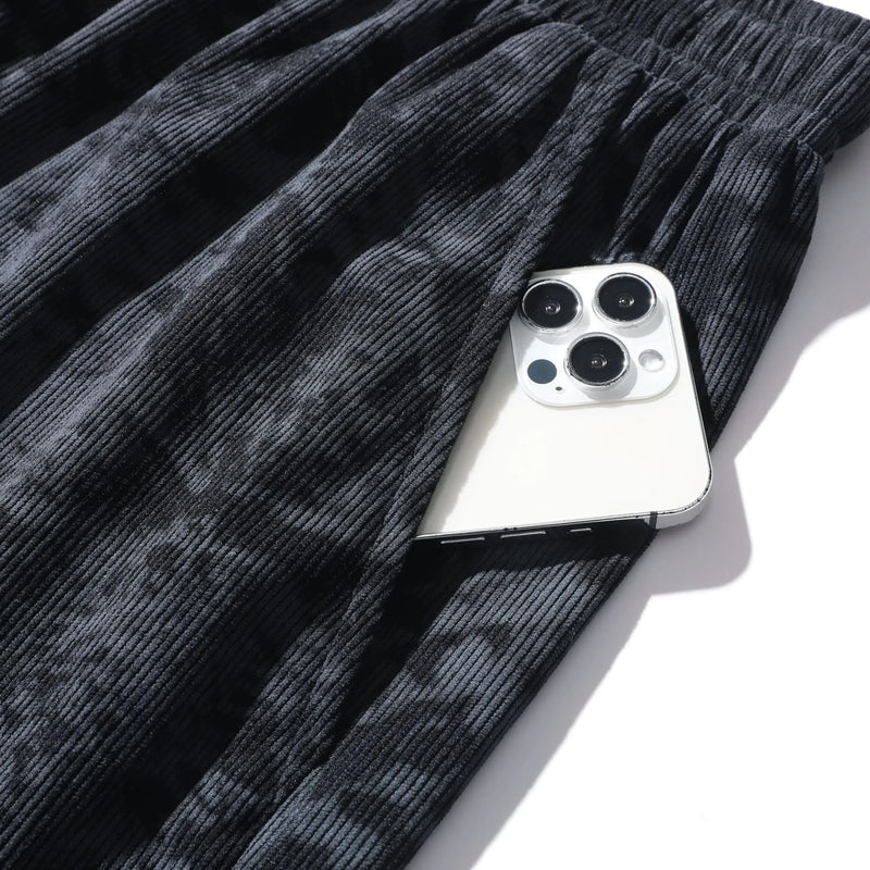 Men's athletic shorts in polyester corduroy camouflage pattern with micro-elasticity fabric, straight-leg cut with fifth pants/mid-length style and high waistband, available in white, grey, and black colours in Asian sizes S to 3XL.