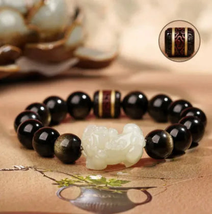 Rainbow eye obsidian beaded bracelet in gold obsidian and jade pi xiu colours.