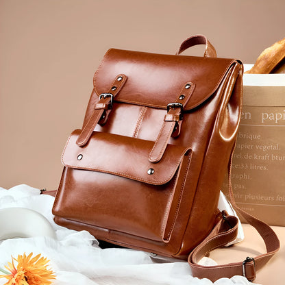 Genuine cowhide leather backpack for women in black, brown, or coffee, showing hard-textured two-layer construction.