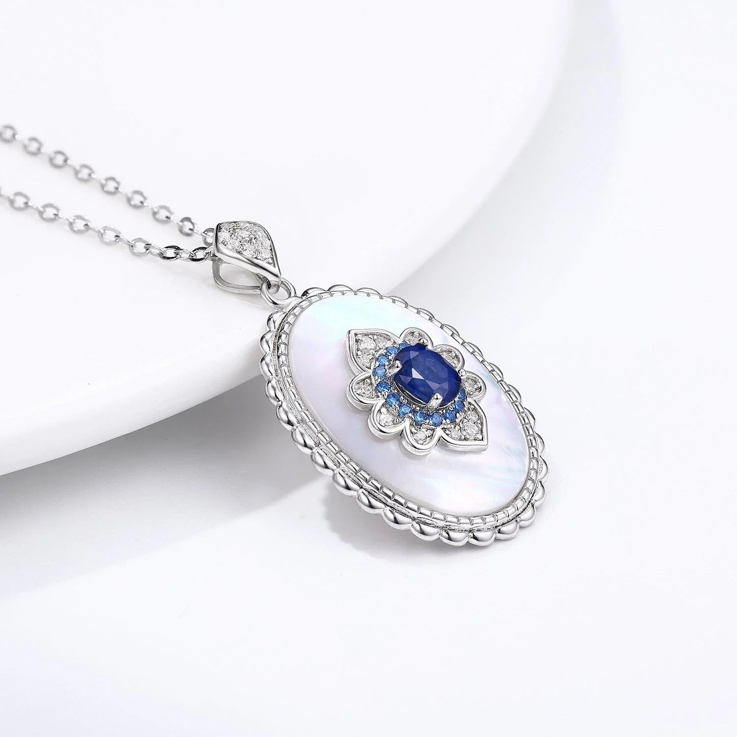 Elegant sapphire and diamond pendant necklace made of 925 sterling silver with a sleek geometric design and O-chain