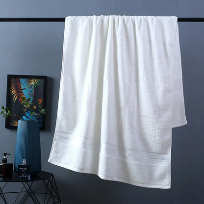 Three-piece cotton towel set showing bath towel, towel, and square scarf in coordinating colours