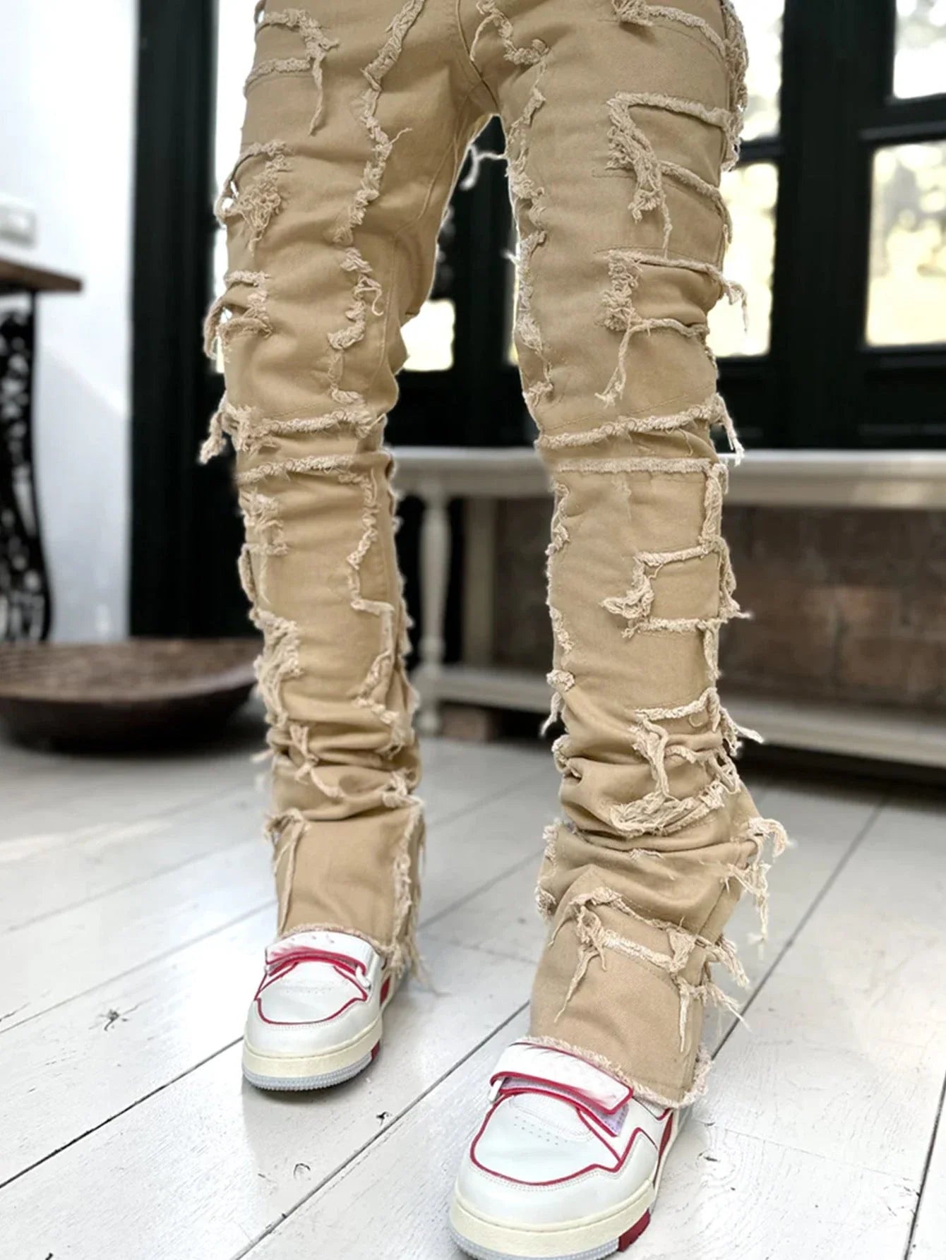 Stylish patched men's jeans with tight, stacked fit and variety of vibrant color options