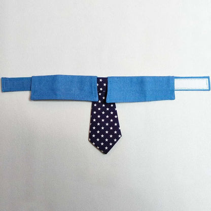 Blue denim dog collar with white star pattern, styled as an adjustable bow tie for formal pet wear.