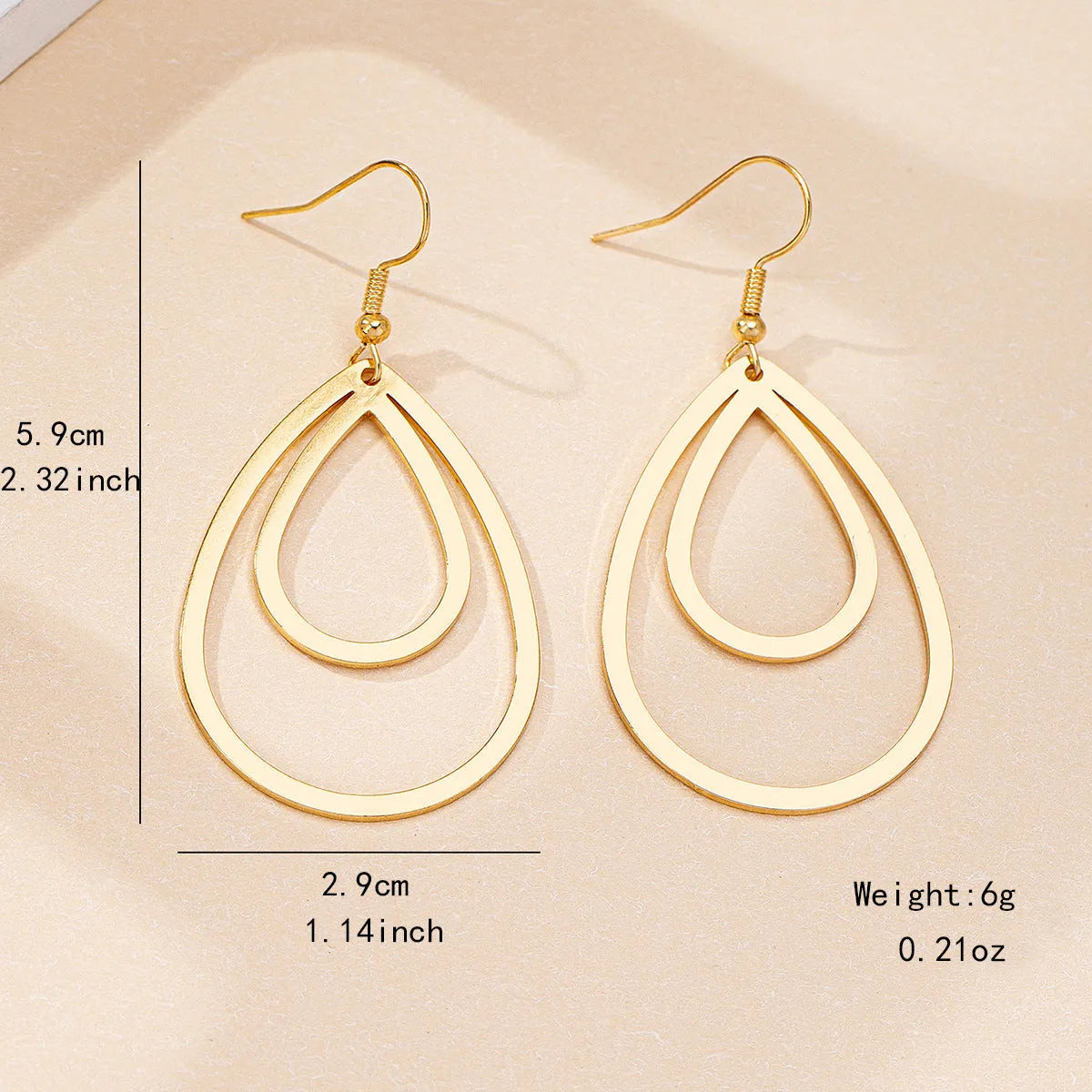 Golden yellow hollow drop earrings made from iron, shown as a single pair for everyday fashion.