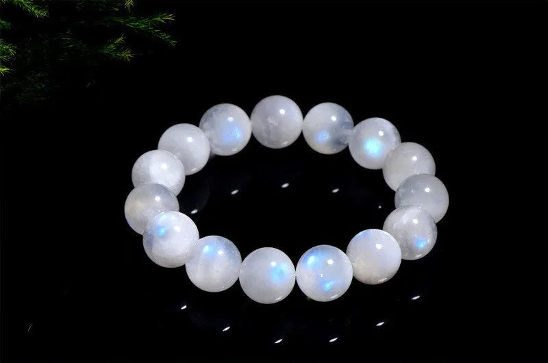 Natural blue moonlight round bead bracelet in white with polished moonstone beads showing blue sheen effect