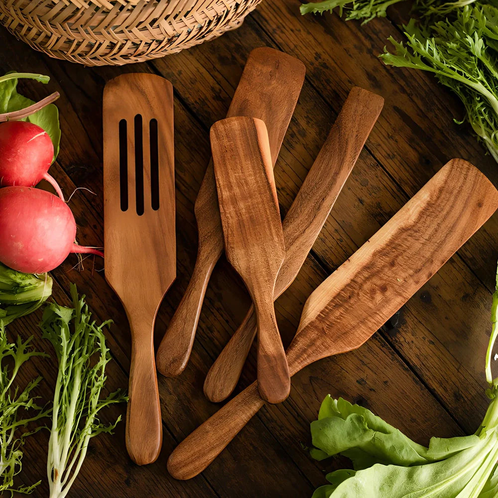 Five teak wood spatulas in sizes from 23cm to 34cm including kitchen shovel and cooking spatulas