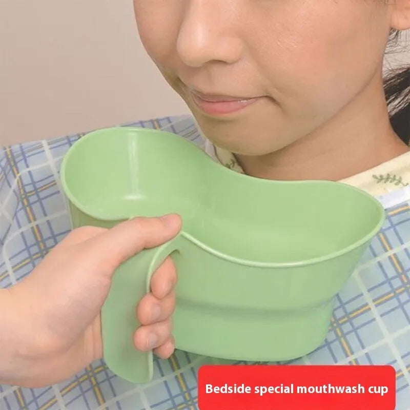 Green plastic gargle cup for bedridden elderly oral care showing modern simplicity design