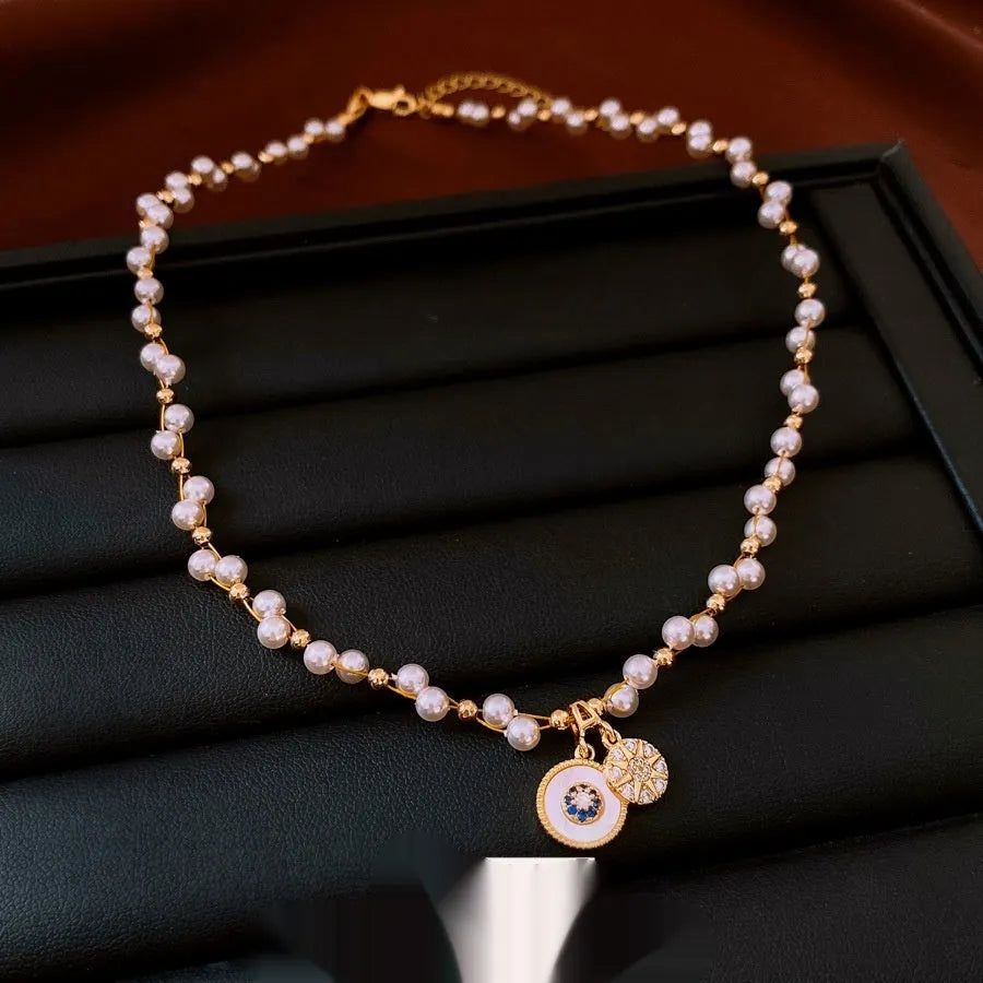 Gold-white necklace with round geometric pendant featuring zircon and imitation pearl on adjustable 41-50cm chain