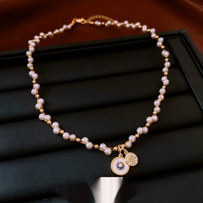 Gold-white necklace with round geometric pendant featuring zircon and imitation pearl on adjustable 41-50cm chain
