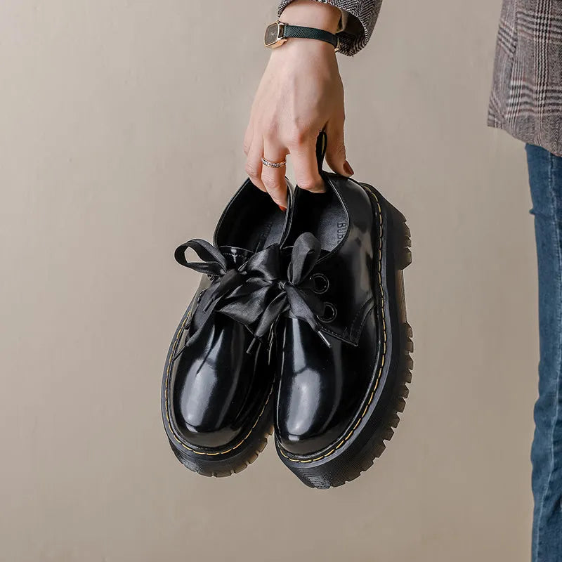 Women's black and white thick-soled leather shoes with cross-strap design and TPR tendon soles