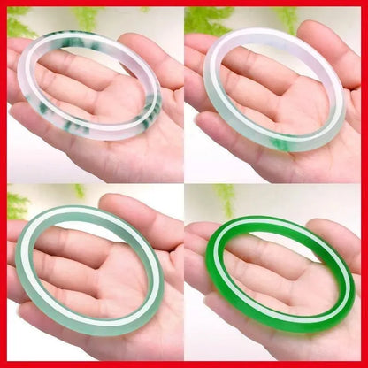 Jade bracelet with floating flower patterns and auspicious cloud motifs in green stone with polished finish