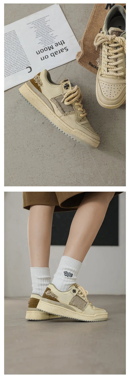 Beige low-top vintage-style skate shoes on a white background, showing round toe and lace-up front.