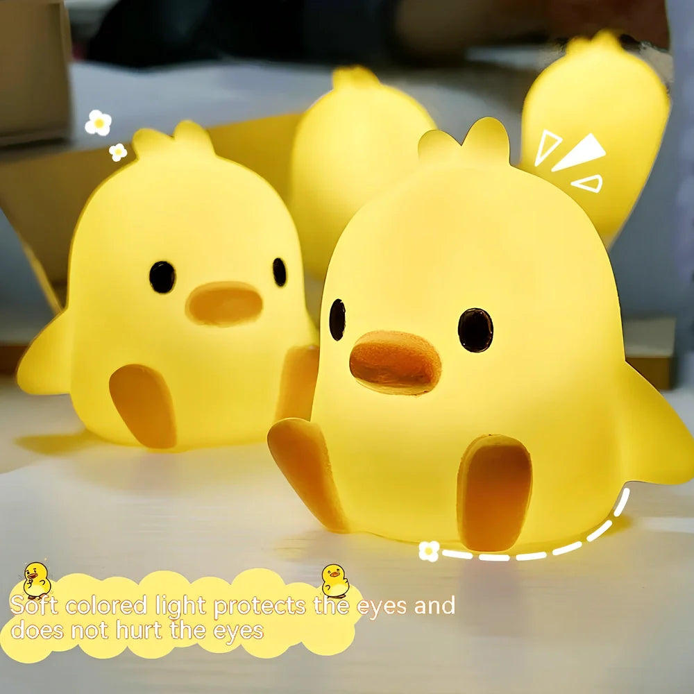 Small yellow duck-shaped night lamp measuring 6cm tall with warm LED light