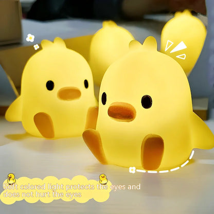 Small yellow duck-shaped night lamp measuring 6cm tall with warm LED light
