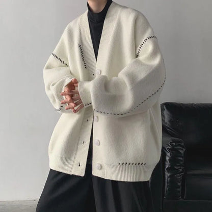 Women's knitted cardigan top coat in black or white, loose fit with long sleeves, made from 100% polyester