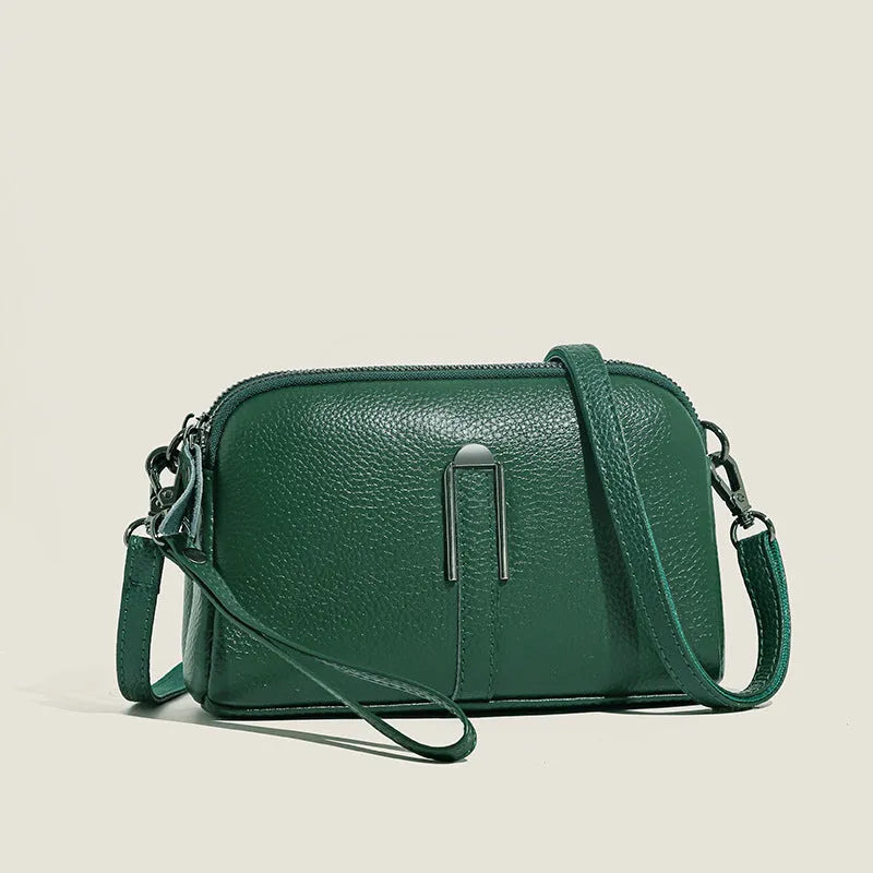 Women's genuine leather square shoulder bag in black, shown from front, displaying structured horizontal shape.