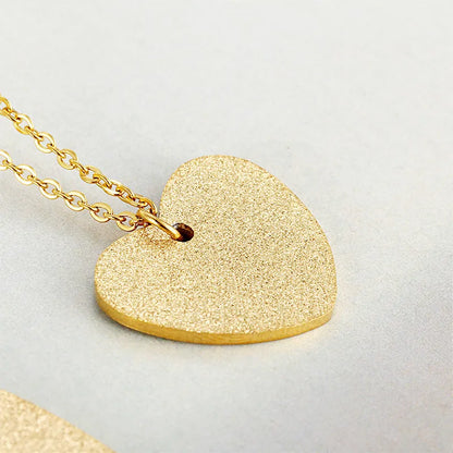 Women's titanium steel necklace with a simple geometric heart-shaped pendant.