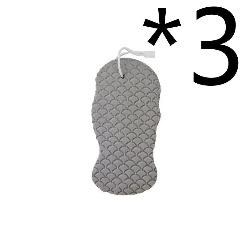 White 3D bath ball sponge with a fish scale exfoliating texture on a blue background.