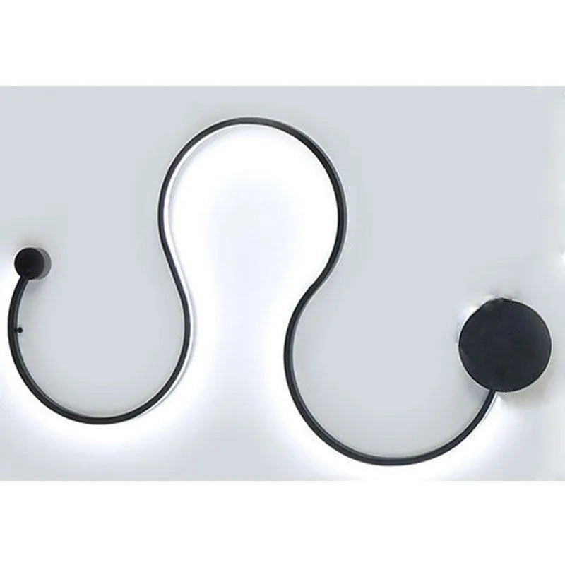 Modern black and white LED wall lamp with aluminium shade in four different sizes for bedside or corridor lighting