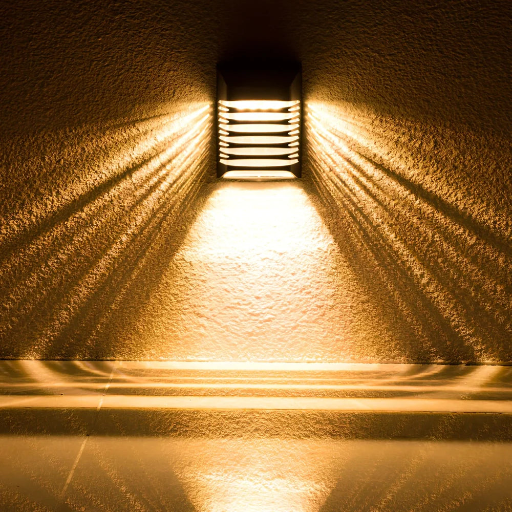 Black solar wall lamp with polycrystalline silicon panel measuring 90x20x53mm for outdoor garden lighting