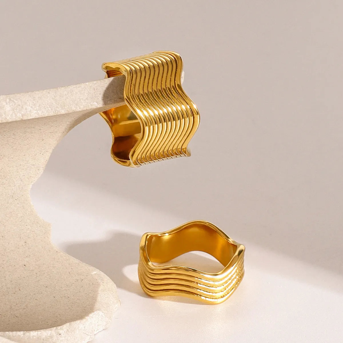 Stainless steel geometric wave ring with 8mm wide band and electroplated finish