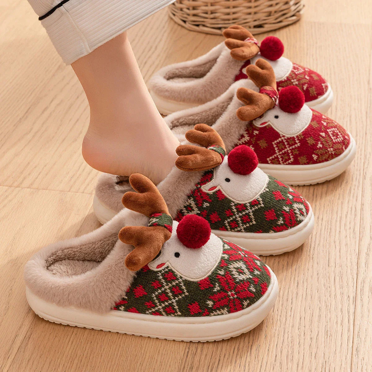 Cozy elk-inspired plush slippers in festive Christmas green and red colors, featuring a soft, comfortable upper and non-slip soles for indoor wear