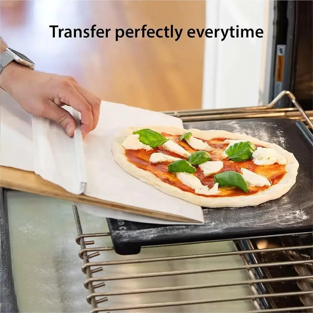 White PP plastic pizza transfer shovel measuring 55cm by 35cm on kitchen counter
