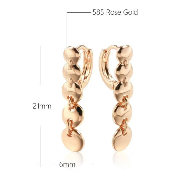 Gold finish hand-woven copper circle earrings showing textured surface and 5cm diameter