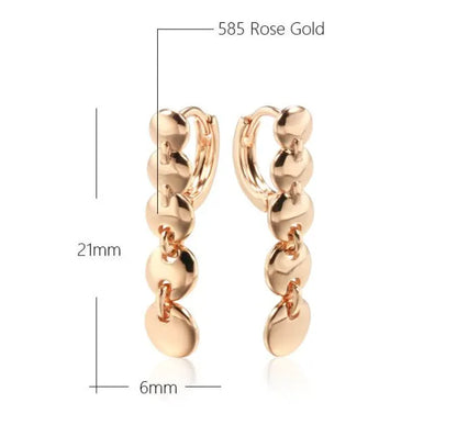 Gold finish hand-woven copper circle earrings showing textured surface and 5cm diameter