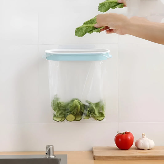 Blue or pink plastic kitchen garbage bag storage rack mounted on a cabinet or bench for organising carrier bags