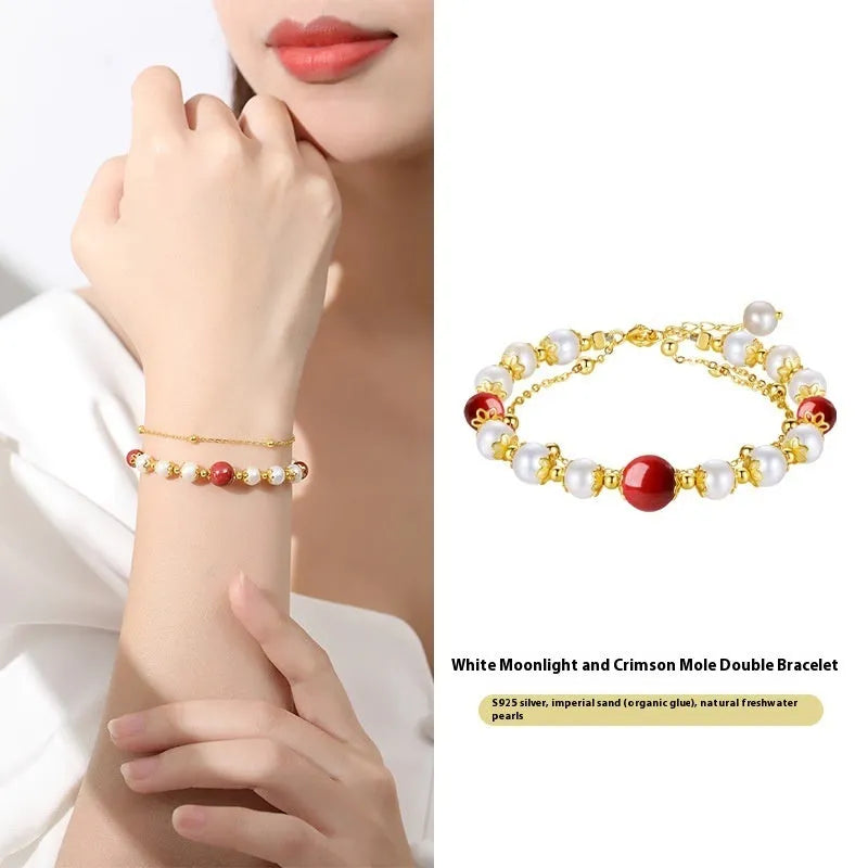 Sterling silver double-layer bracelet with freshwater pearls and red cinnabar bean charms