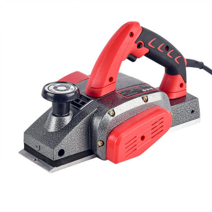 Red desktop electric wood planer with aluminium shell showing 82mm planing width